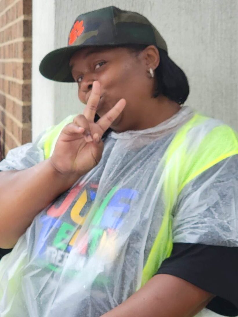 Volunteer helping to organize participants for the Cincinnati Juneteenth Parade.